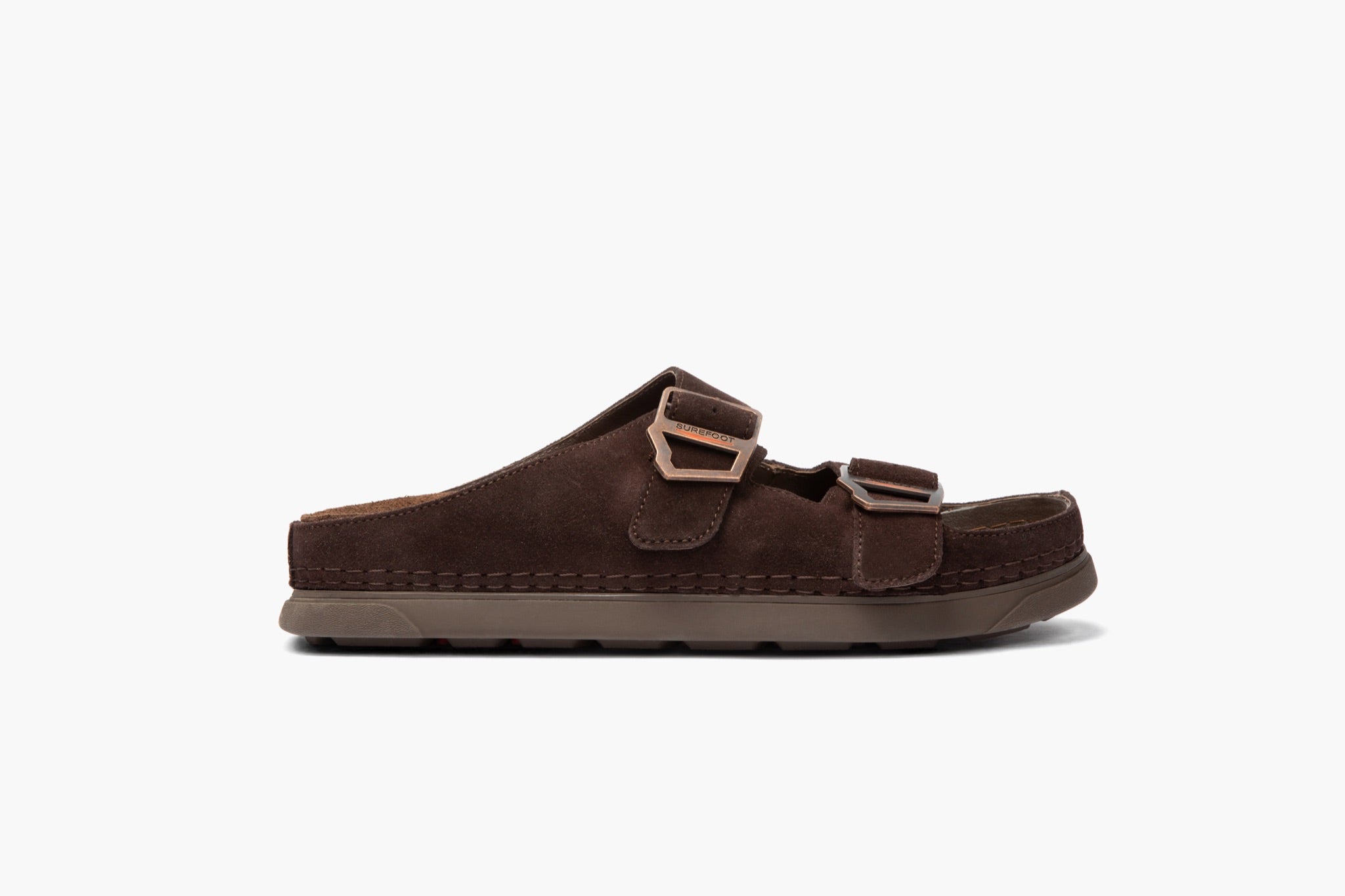Brown sandal with buckle closure on a white background